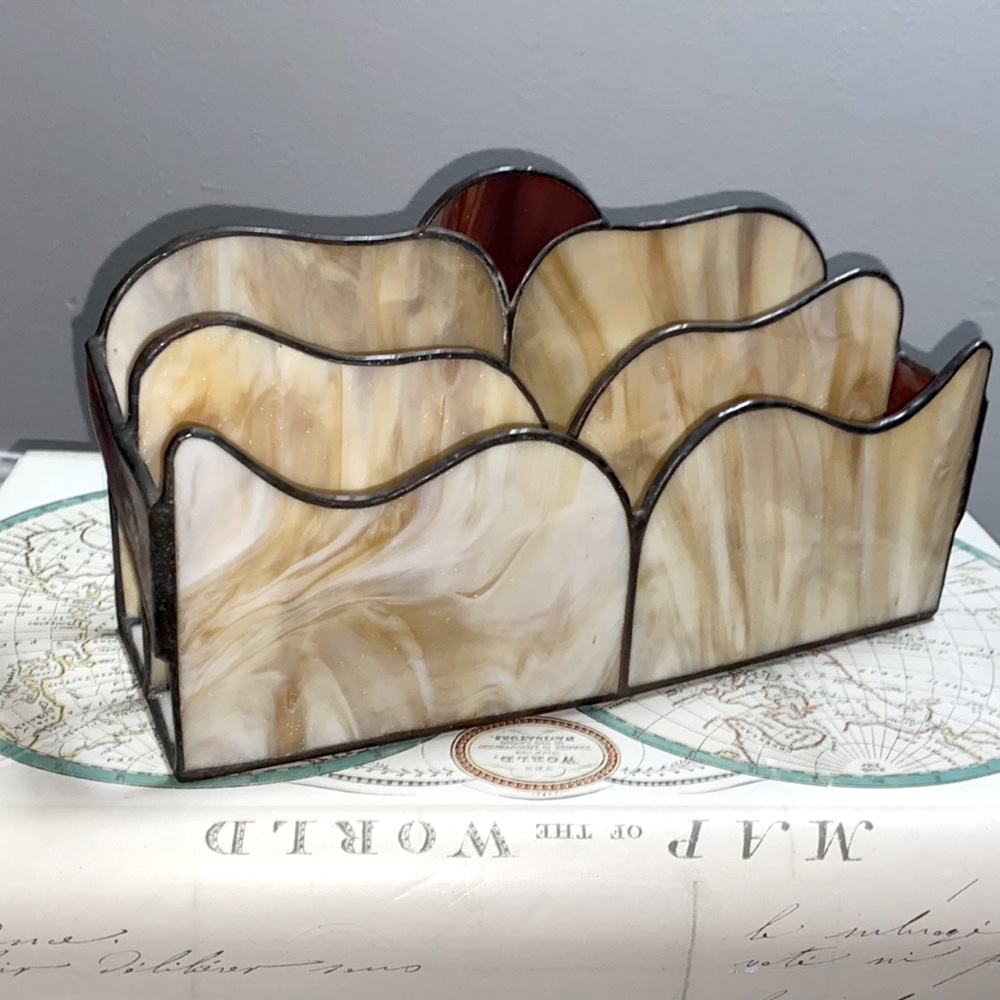 Appears to be hand made with stain glass and welded frame